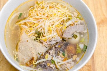 Spicy TOM YAM Stewed pork Thai noodle soup with lemongrass, chilly pasted and lime juice