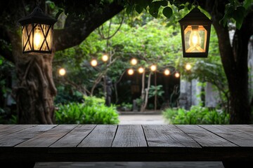 Empty wooden tabletop with hanging lanterns and dreamy garden lights