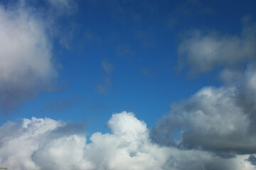 Blue sky with white fluffy clouds