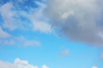 Blue sky with white fluffy clouds