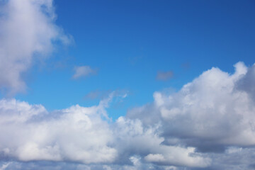 Blue sky with white fluffy clouds