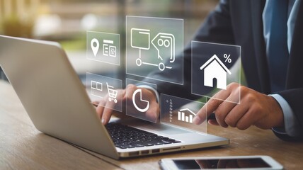 Businessman interacts with digital icons overlayed on a laptop screen