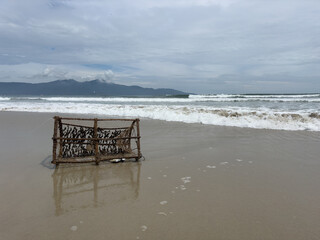 Abandoned fishing cage on the beach in Da Nang Vietnam