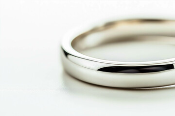 Catalog photo closeup of wedding ring made of white gold, white background.