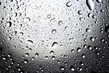 Water drops on glass surface, top view