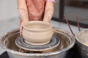 Hobby and craft. Girl making pottery indoors, closeup