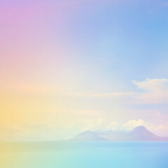 Obraz premium Pastel sky over calm sea with distant mountains