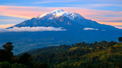 Fototapeta premium Majestic snow-capped mountain peak at sunrise, overlooking lush green valley and hillside villages. Breathtaking landscape photography.