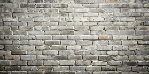 Obraz premium A Textured Wall of Aged Gray Bricks, Showing Subtle Variations in Shade and Mortar