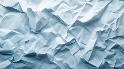 Obraz premium Crumpled blue paper texture creating an abstract background.
