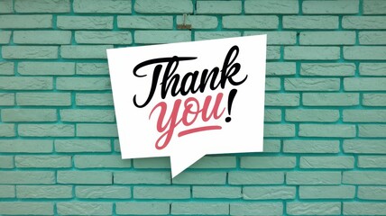Fototapeta premium Thank you message in a speech bubble on brick wall