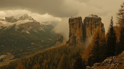 Fototapeta premium Majestic mountain landscape with snow-capped peaks and autumn foliage under dramatic skies