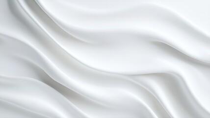 Fototapeta premium Elegant white fabric folds creating a soft, flowing texture for a versatile background or abstract design.