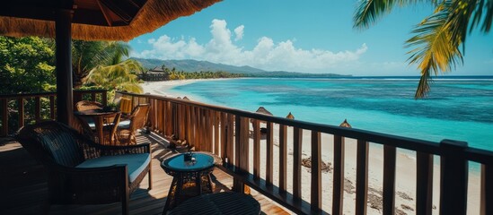Tropical beach view from a private balcony.