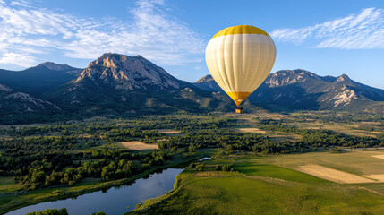 Naklejka premium hot air balloon floats gracefully over scenic mountain landscape, showcasing nature beauty