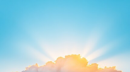 Serene sunrise illuminating fluffy clouds against a clear blue sky, evoking tranquility