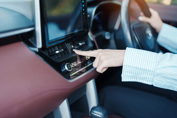 Finger presses the emergency stop button inside the car. Safety and transportation concept