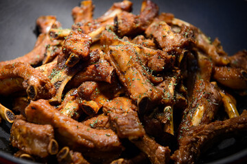 Pork ribs grilled with sauce in a wok