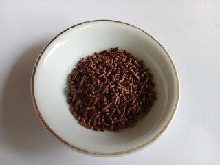 Bowl of Chocolate Sprinkles on a white background