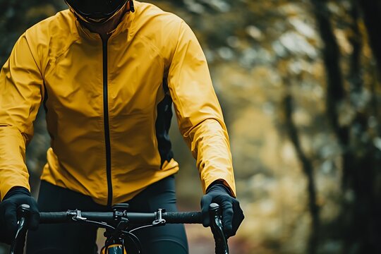 Cyclist in Yellow Jacket on a Bike Path