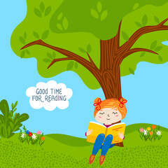 Happy girl reading a book under a tree