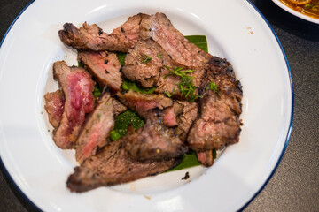 Thai slice of juicy grilled beef. Thai food style for eating with Somtum. Thai grilled beef brisket