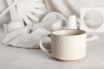 Ceramic mug on light background