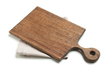 Wooden cutting board and grey napkin on white background