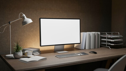 A modern dark loft office workspace features a computer and decorative items on a wooden desk.
