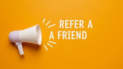 Refer a Friend. Business concept image with paper cup megaphone on orange background with copy space. Attention concept announcement. Minimal flat lay