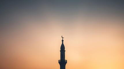 Mosque Minaret Silhouette Against Colorful Sunset Sky in Calm Scene