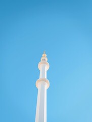 Obraz premium Mosque Minaret Against Bright Blue Sky in Middle East Scenery