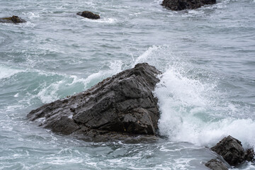 waves crashing on rocks
