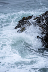 waves crashing on rocks