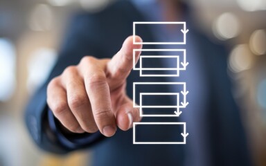 Man points at a digital checklist with a suit on