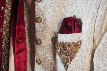 Elegant attire with rich textures and intricate embroidery
