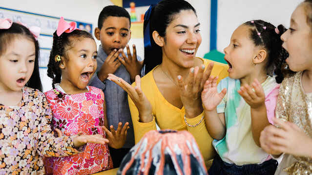 Teacher and group of children learning at nature science at kindergarten class, Diverse students studying at elementary school. Education concept