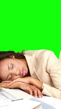 Businesswoman sleeping on her desk