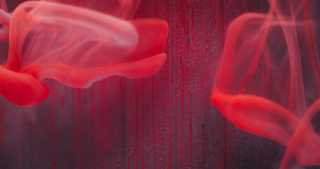 Blur liquid emulsion. Paint water texture. Defocused red color shine drops flow fluid smoke wave on...