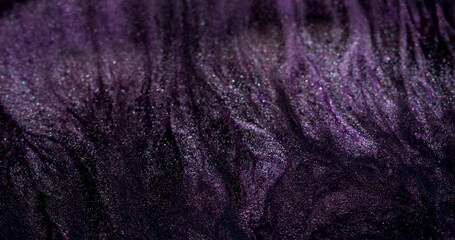 Ink flow. Liquid drip. Gray purple black paint stream spill over abstract shimmering background fluid surface. Dark art spray mix defocused spatter.