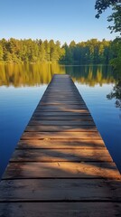 Naklejka premium Serene wooden dock on a calm lake surrounded by lush green trees in bright daylight
