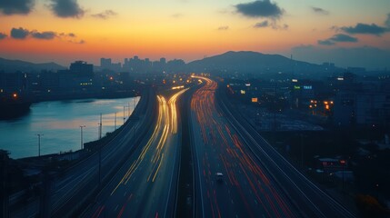 Obraz premium Sunset highway traffic cityscape aerial view