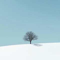 Solitary Tree on Snowy Landscape Under Clear Blue Sky