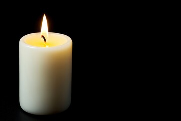 Single White Candle with Flame on Black Background in Dark Setting