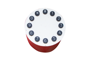 Numbers of telephone buttons on white circular wooden platform on old red telephone booths for display in public parks or resorts. Isolated on cut out PNG or transparent background.