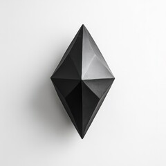 Pure white wall with a small, geometric black sculpture