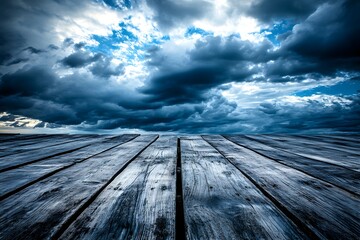 Dramatic sky over weathered wood planks