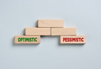 Optimistic and pessimistic words on wooden cubes forming a bridge