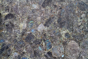 Labradorite granite texture. Texture of natural stone close-up.