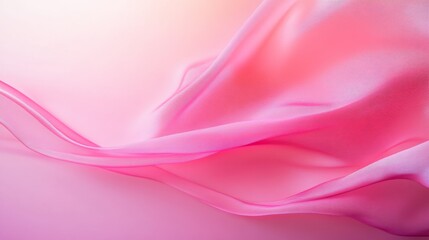 Fototapeta premium A flowing pink satin ribbon twists elegantly in mid-air, contrasting beautifully against a glossy pastel pink backdrop illuminated by soft, diffused lighting